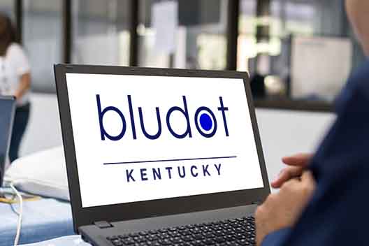 laptop computer with bludot kentucky logo on screen