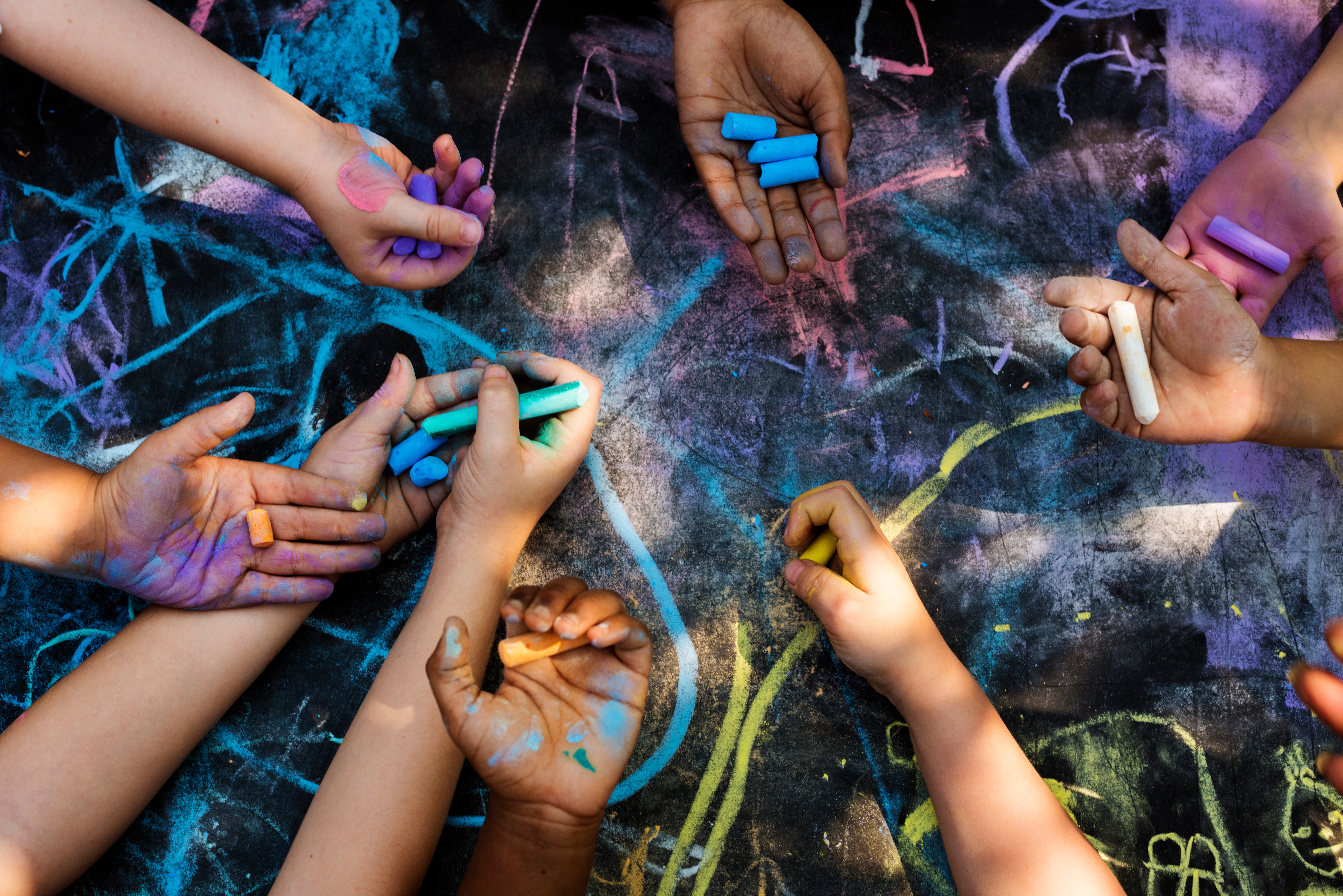 children holding chalk