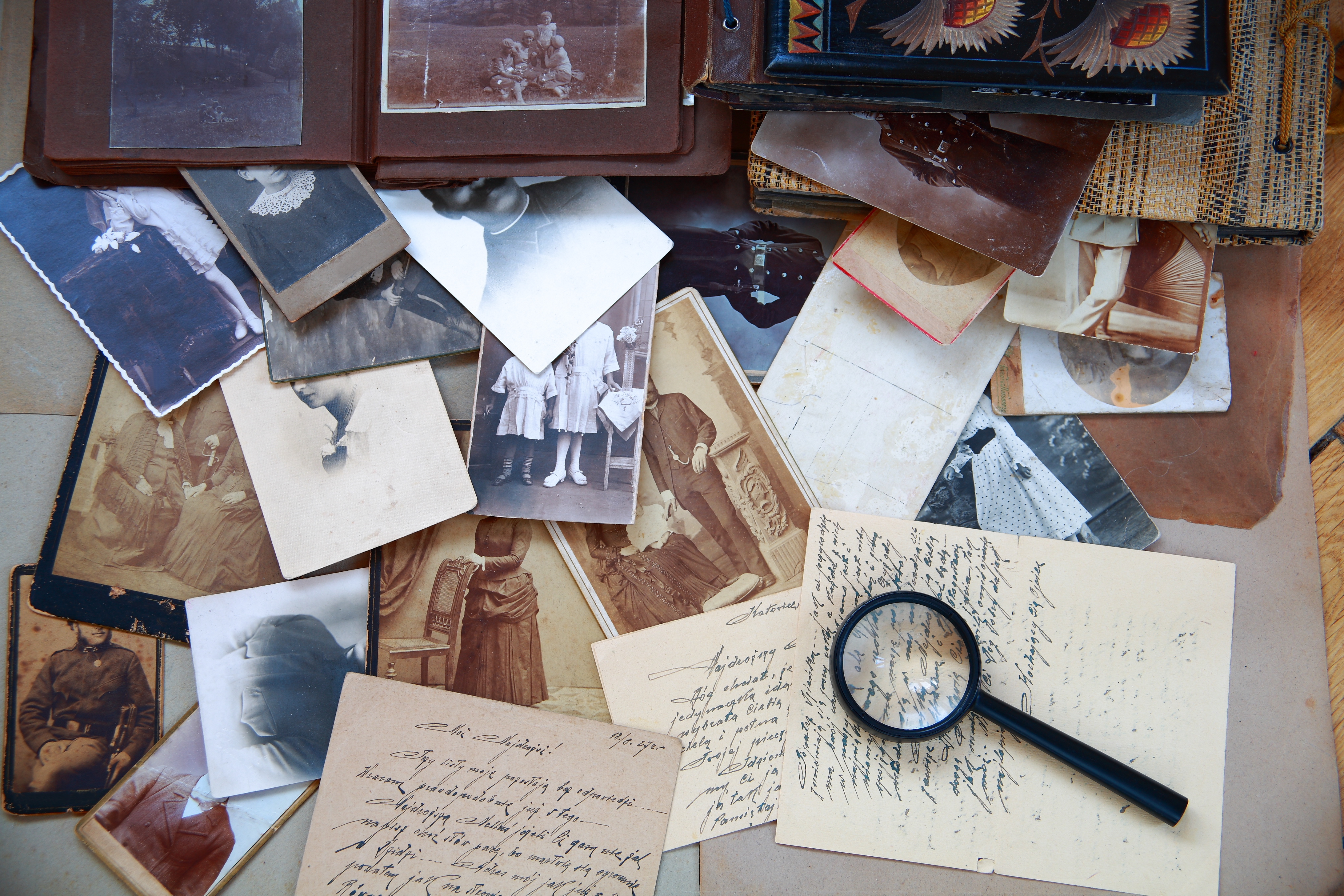 photos, letters, magnifying glass, and other sentimental items
